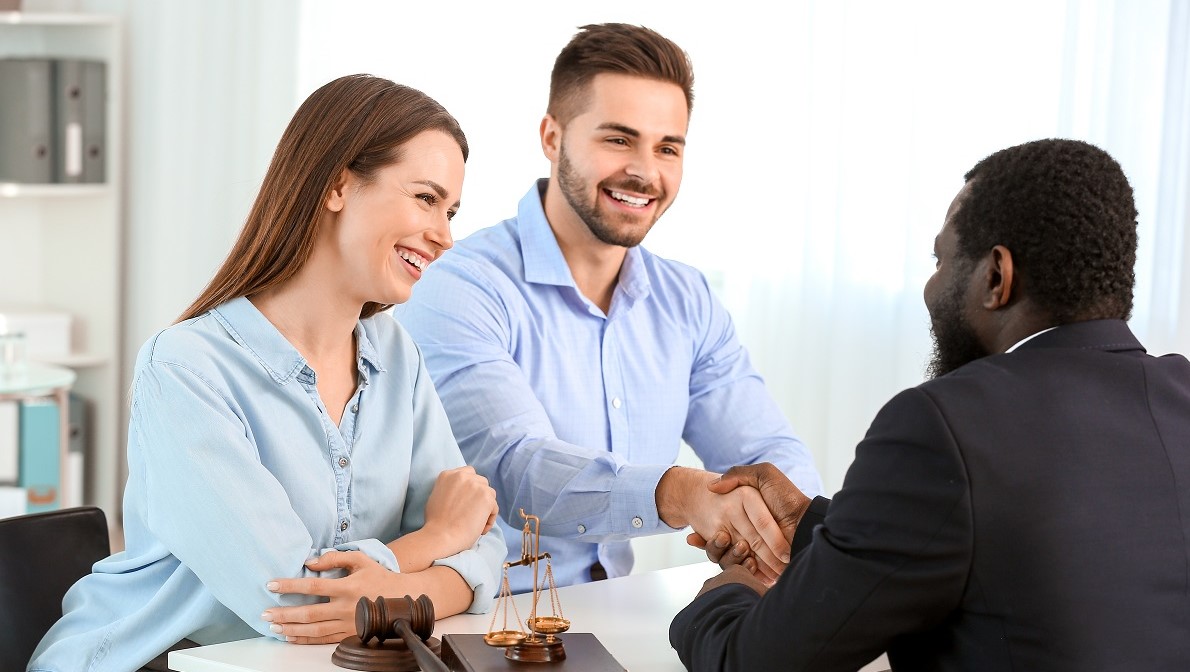 Couple visiting lawyer in office